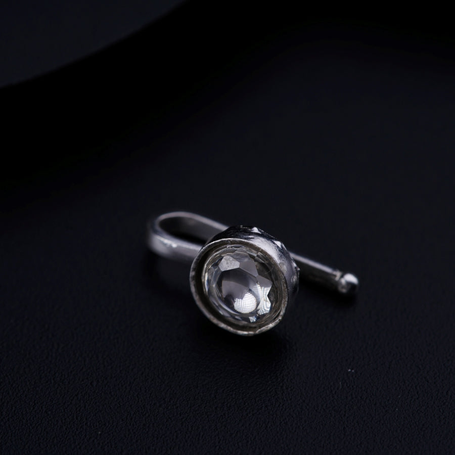 a close up of a ring on a black surface