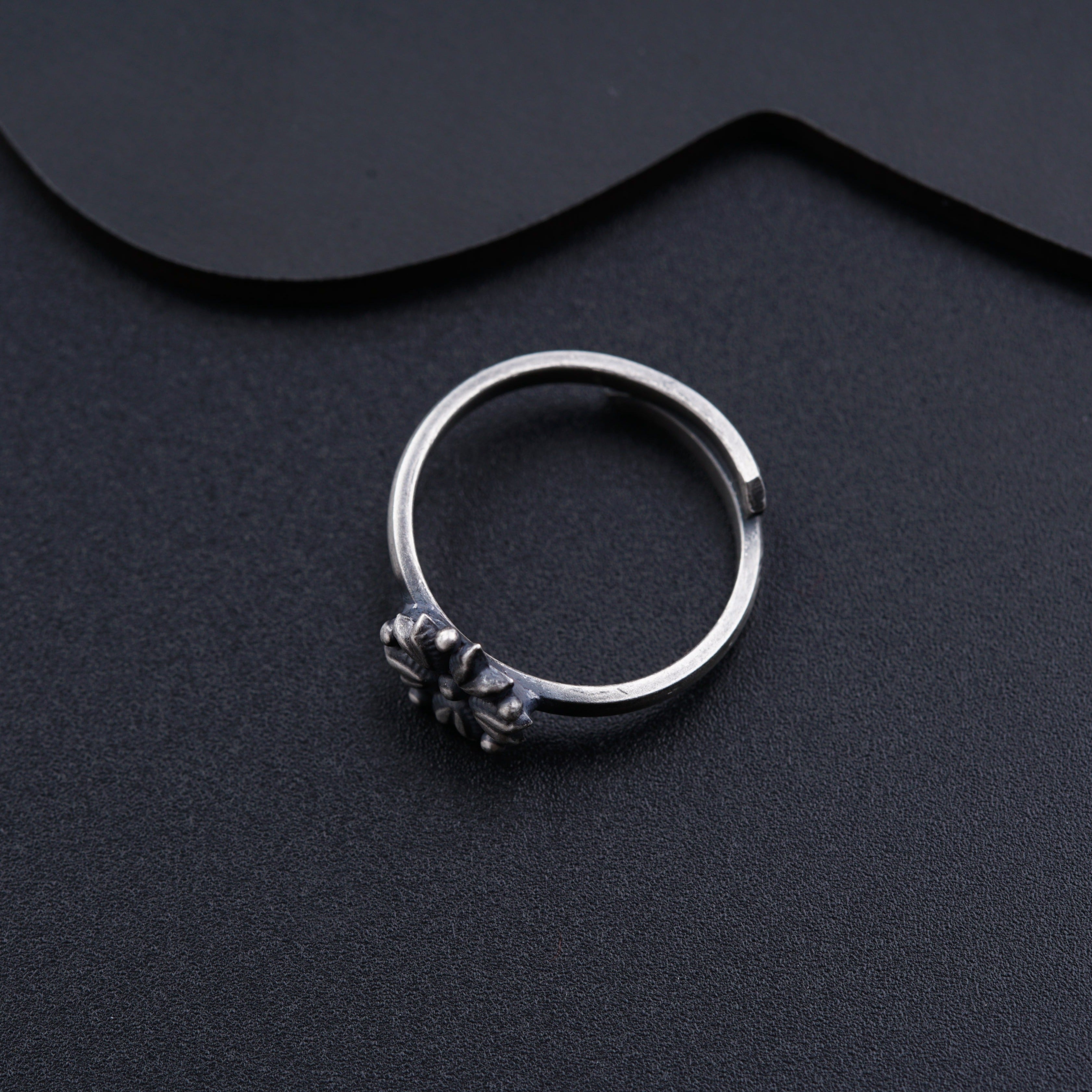 a close up of a ring on a black surface