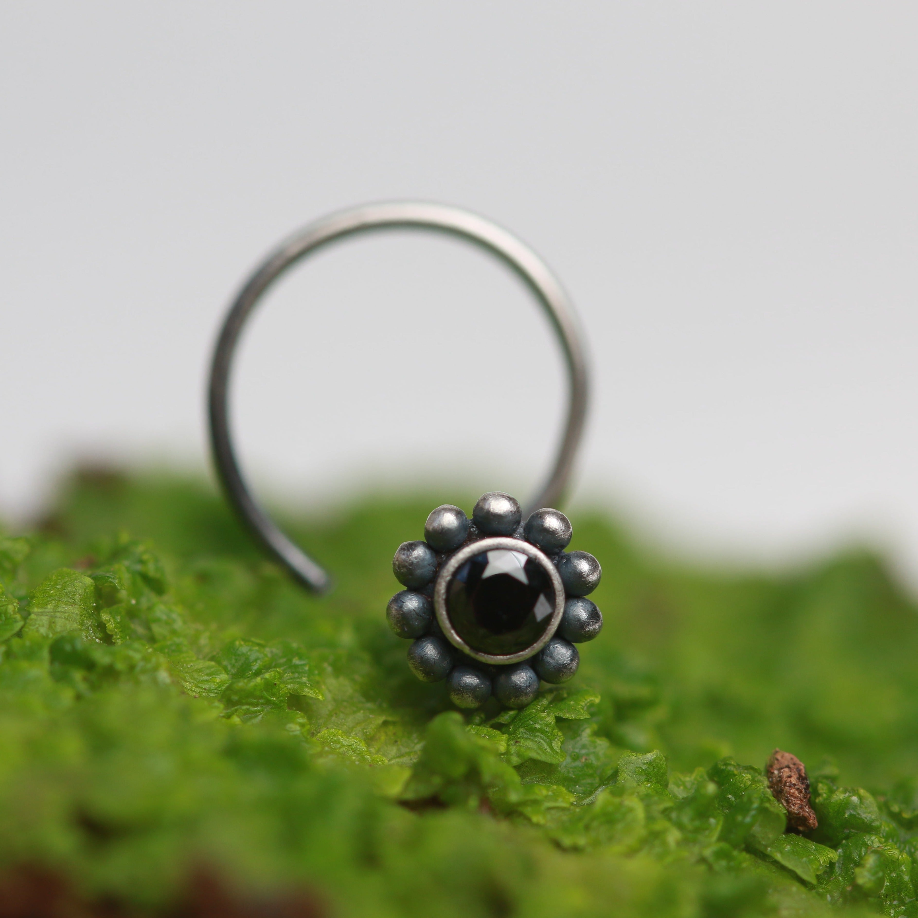 a close up of a ring on a leaf