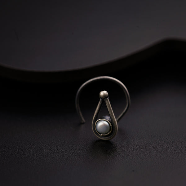 a close up of a ring on a black surface