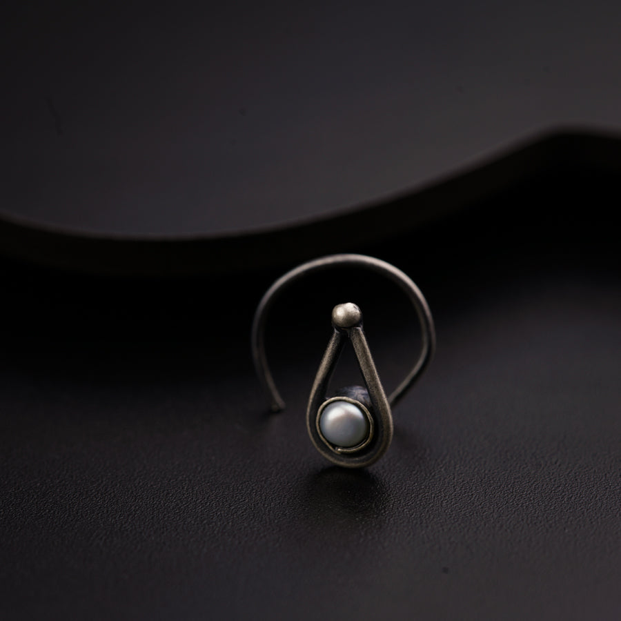 a close up of a ring on a black surface