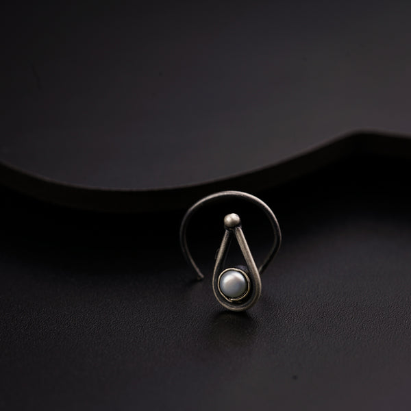 a close up of a ring on a black surface