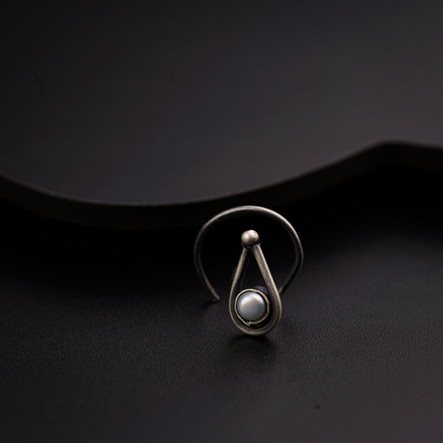 a close up of a ring on a black surface