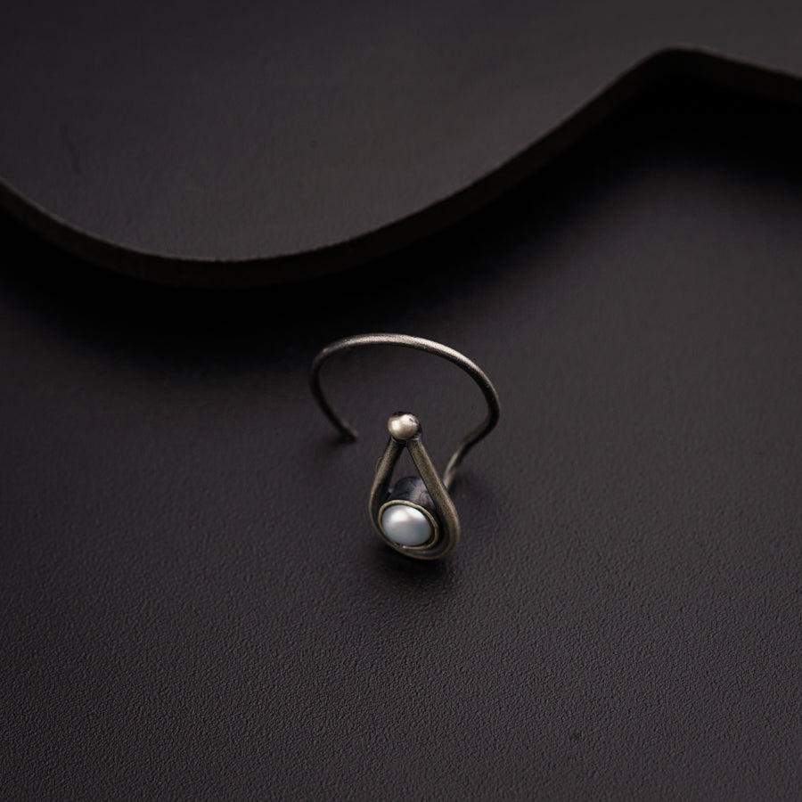 a close up of a ring on a black surface