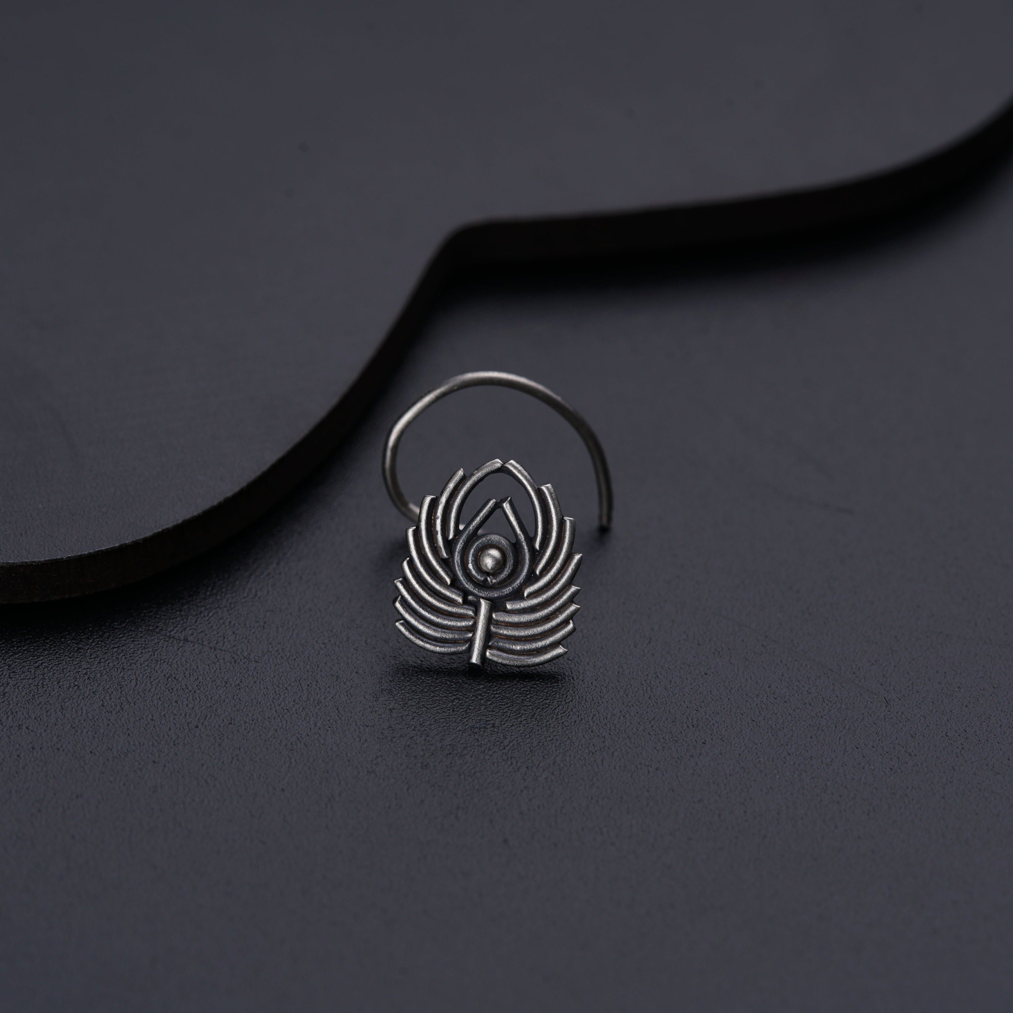 a close up of a ring on a black surface