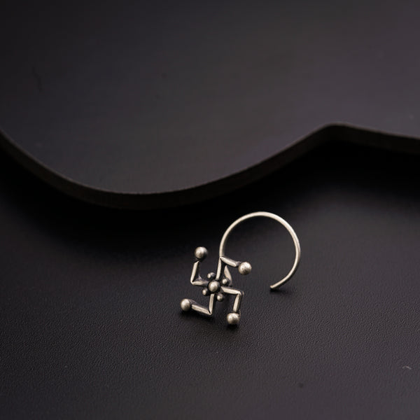 a pair of earrings sitting on top of a table