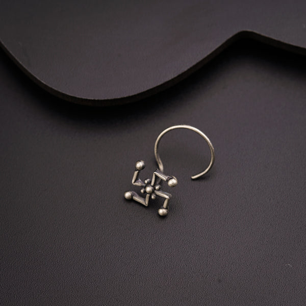 a pair of earrings sitting on top of a table