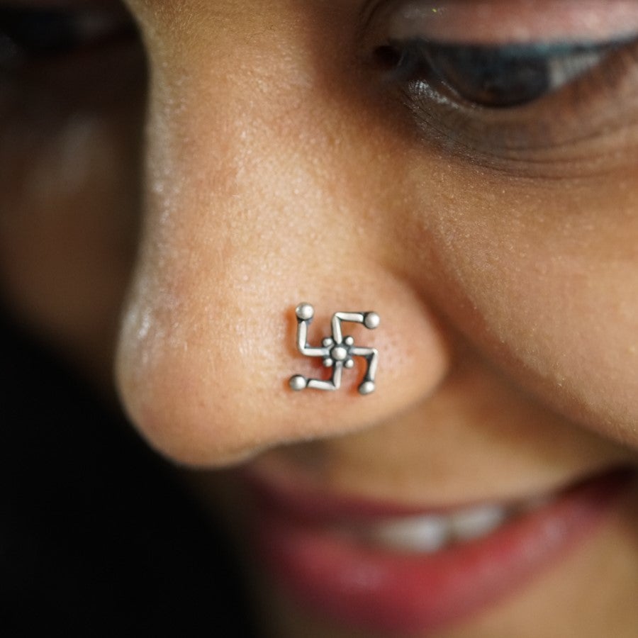 a close up of a person with a nose piercing