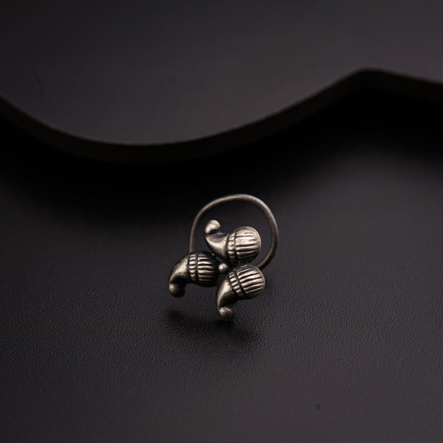 a close up of a ring on a black surface