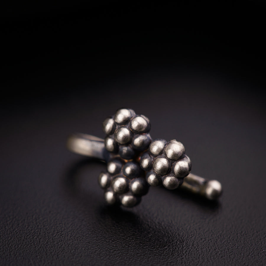 a close up of a ring on a black surface