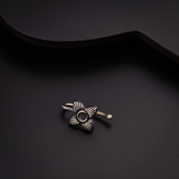 a close up of a metal object on a black surface