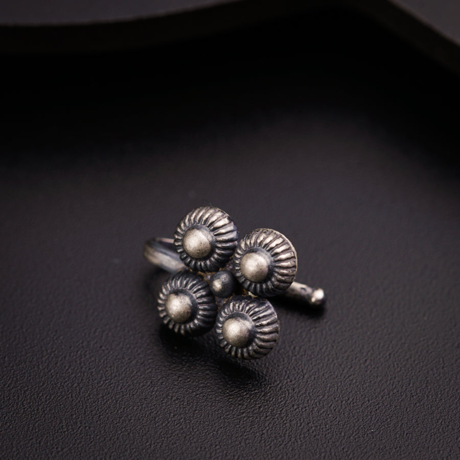 a close up of three rings on a black surface