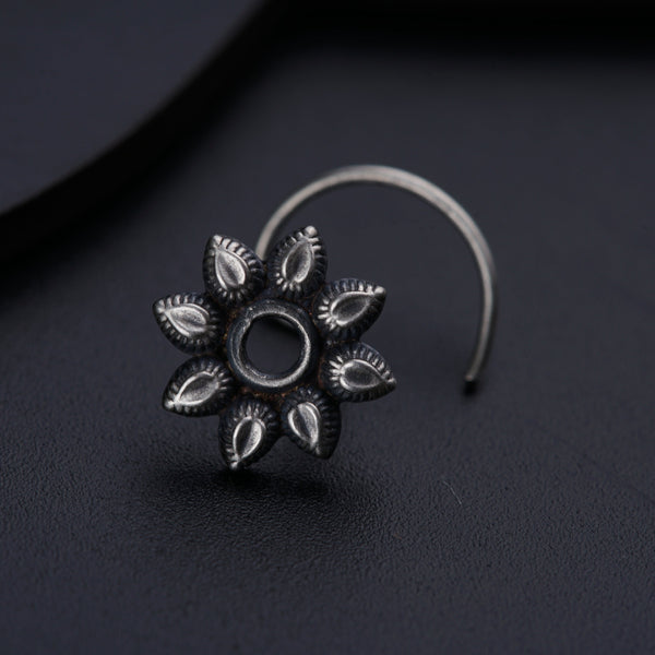 a close up of a ring on a black surface