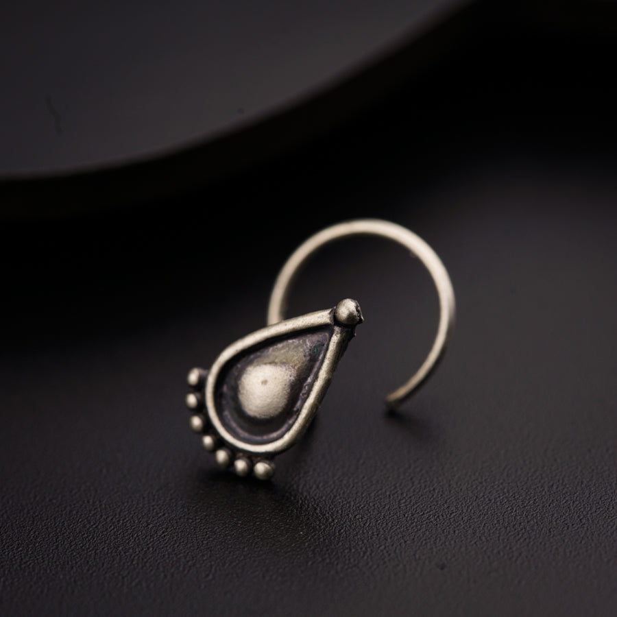 a close up of a pair of earrings on a table