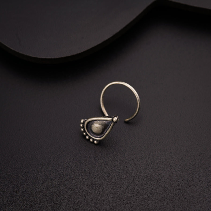 a close up of a ring on a black surface