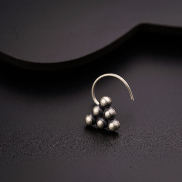 a close up of a pair of earrings on a table