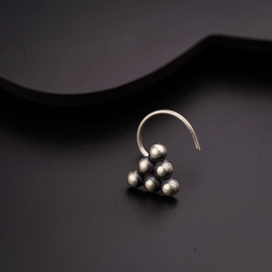 a close up of a pair of earrings on a table