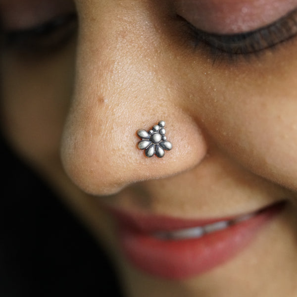a close up of a person with a nose piercing