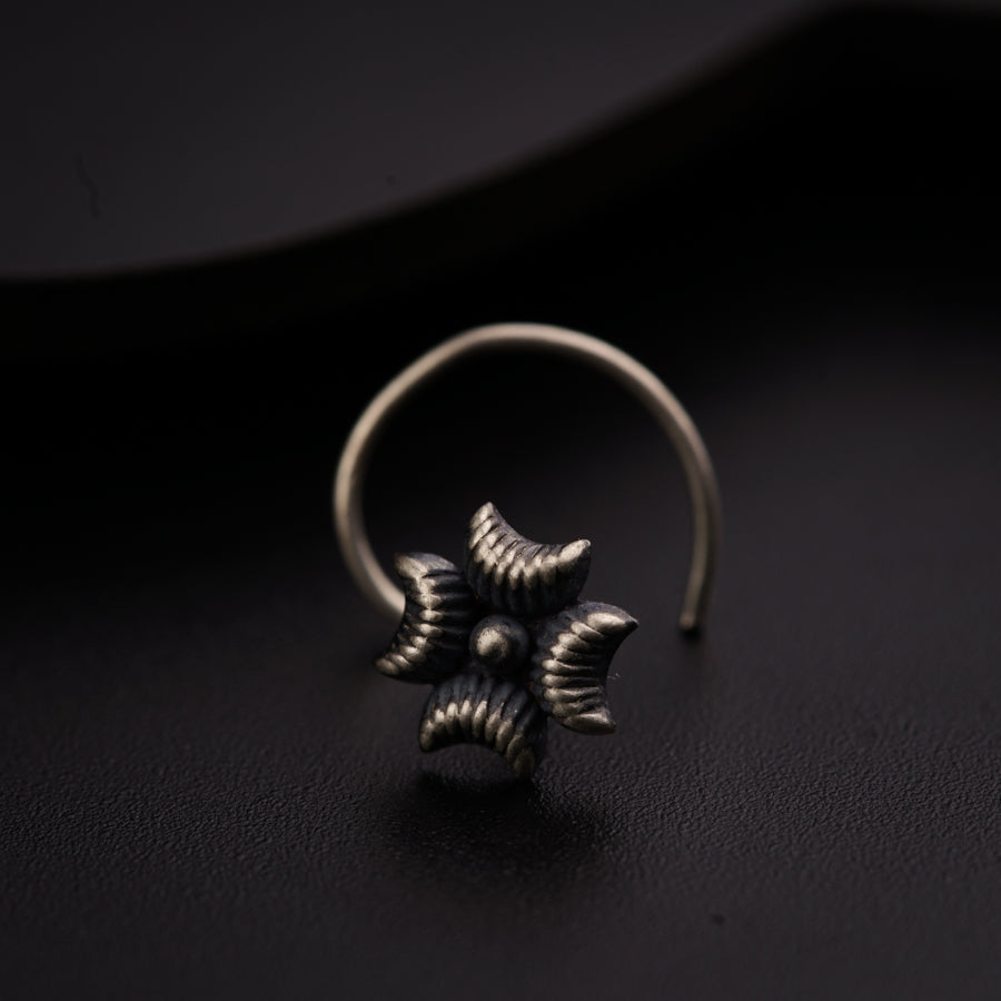 a close up of a ring on a black surface