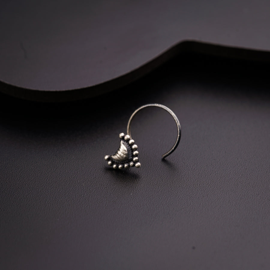a close up of a pair of earrings on a table
