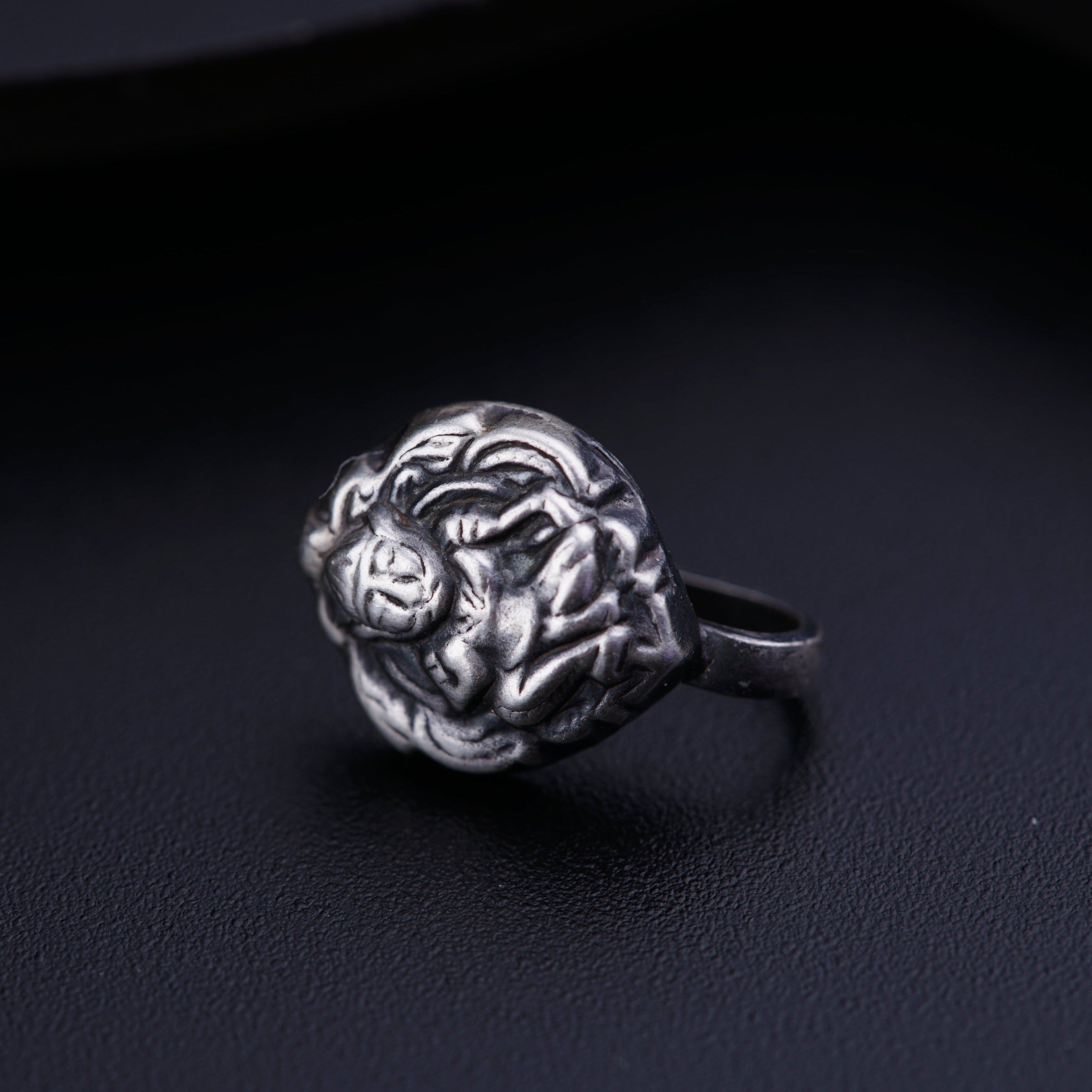 a close up of a ring on a black surface