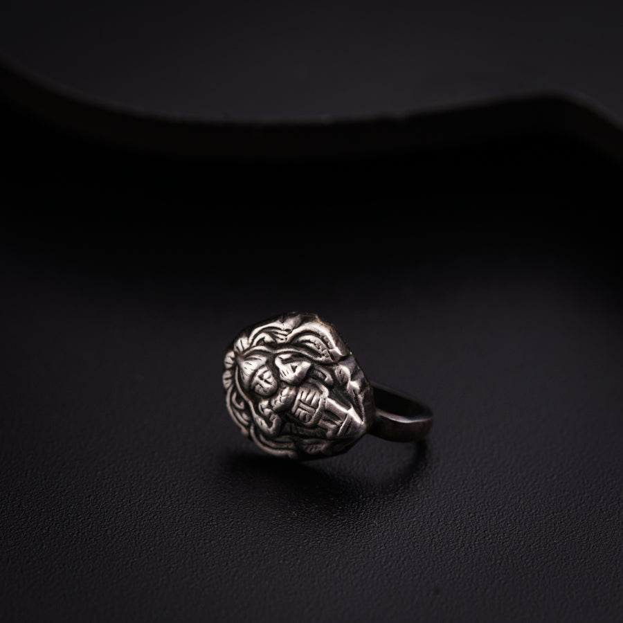 a close up of a ring on a black surface