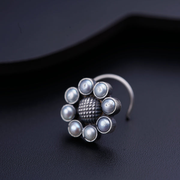 a close up of a ring on a black surface