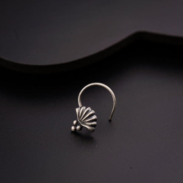 a close up of a ring on a black surface