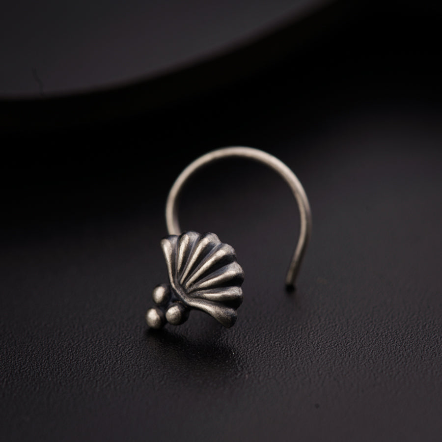 a close up of a ring on a black surface