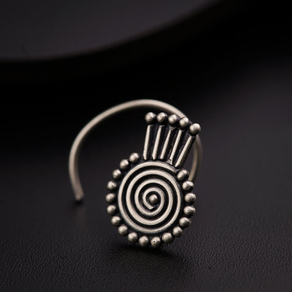 a close up of a ring on a black surface