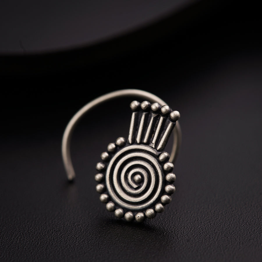 a close up of a ring on a black surface