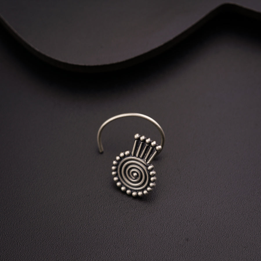 a close up of a pair of earrings on a table