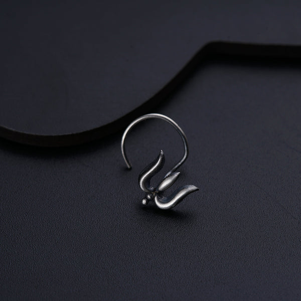 a close up of a metal object on a black surface