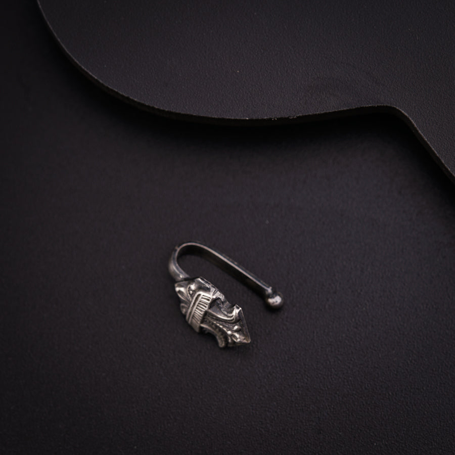 a pair of scissors sitting on top of a black surface