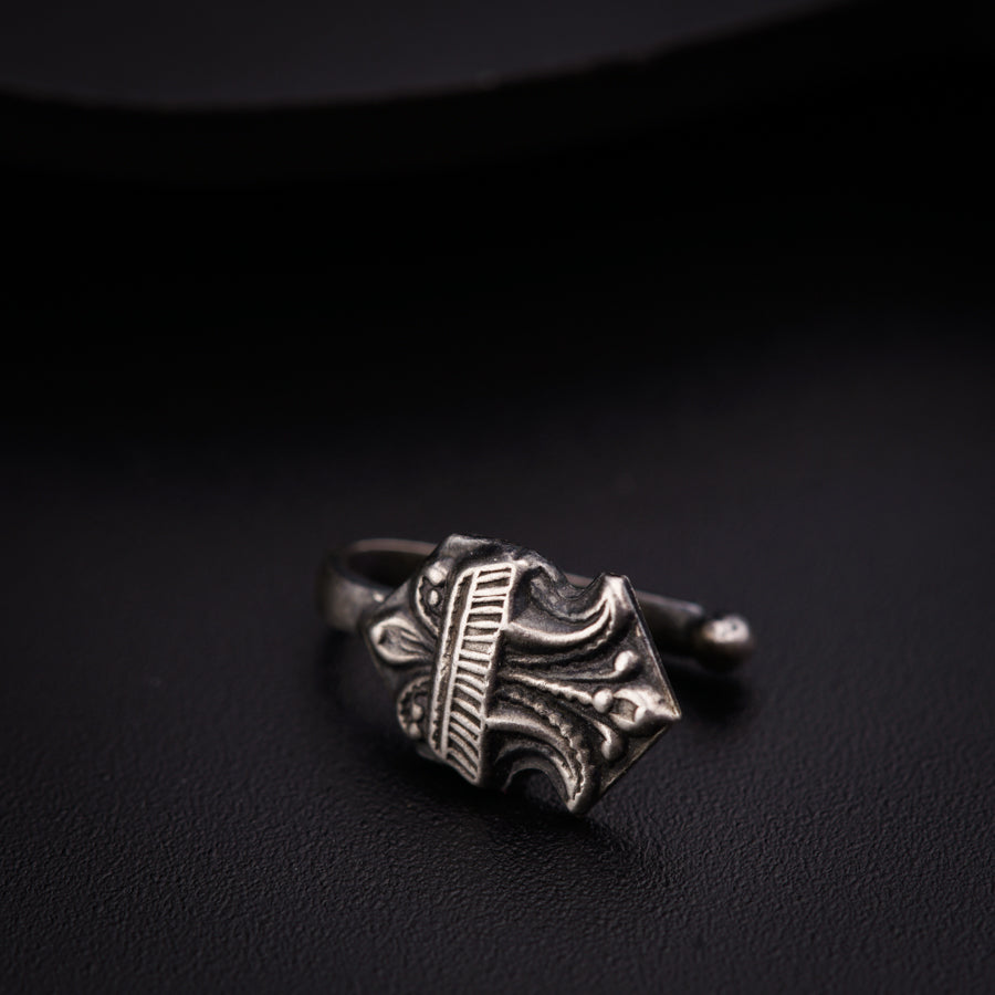 a close up of a ring on a black surface