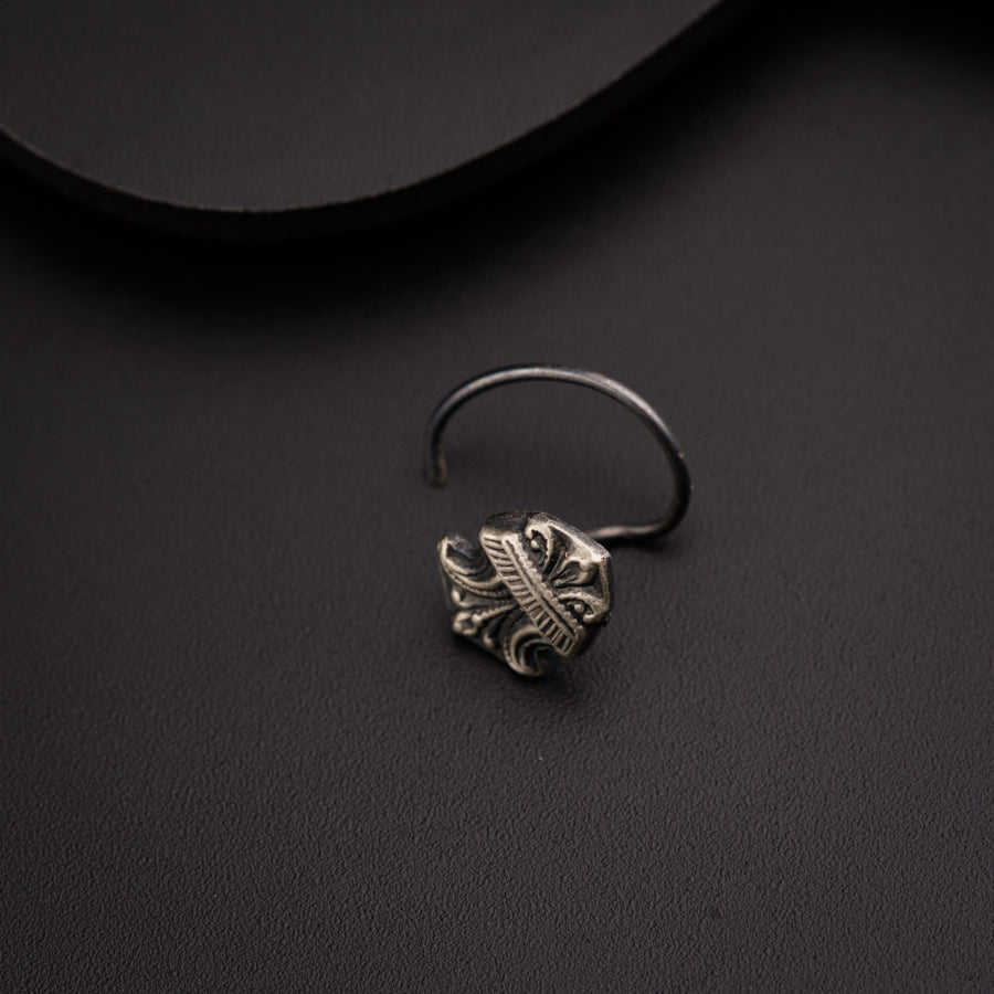 a close up of a ring on a black surface