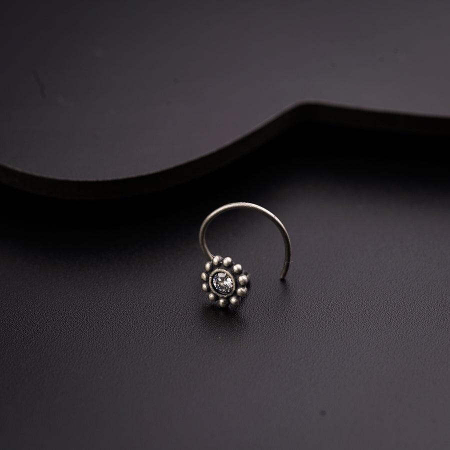 a close up of a ring on a black surface