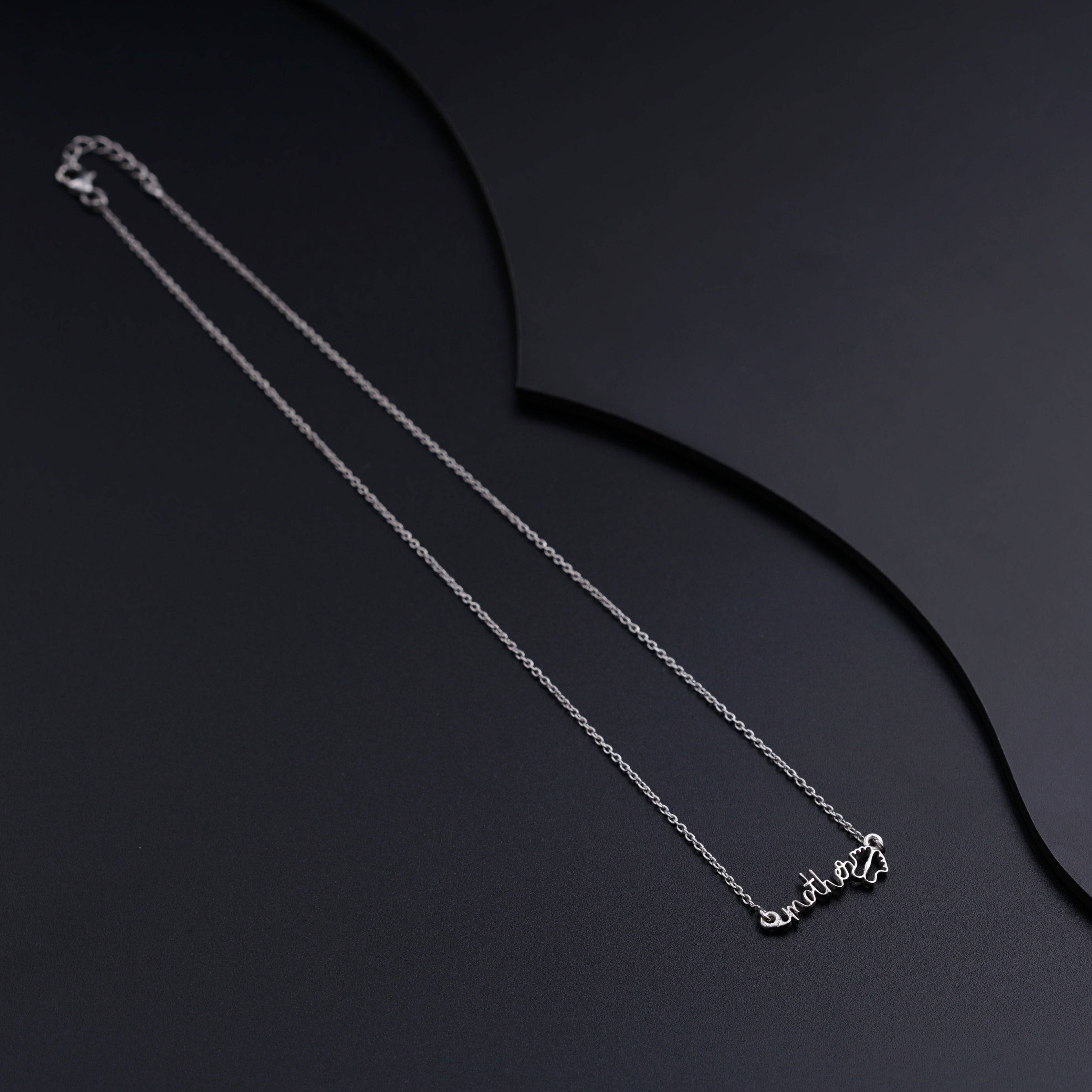 a couple of necklaces sitting on top of a table