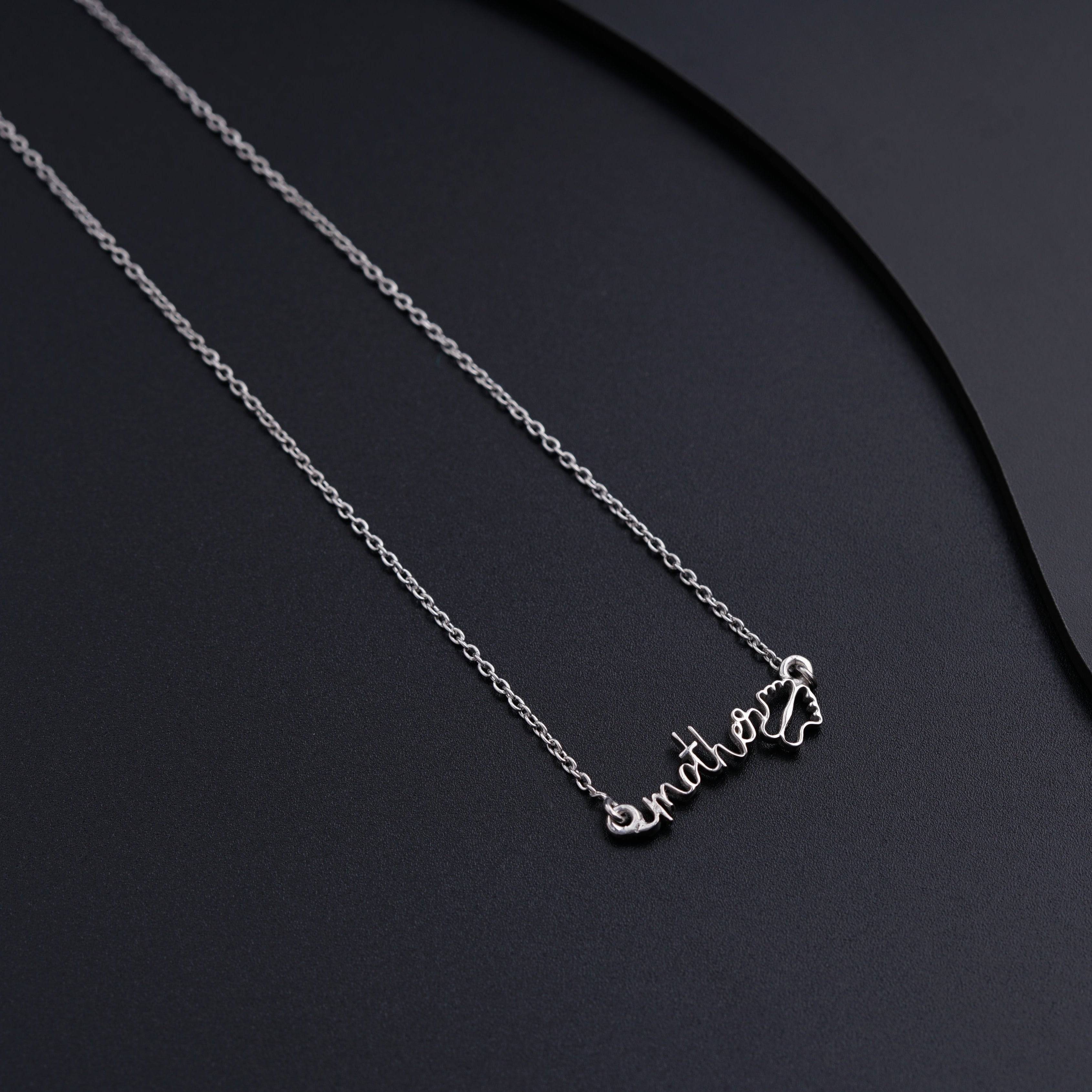 a couple of necklaces that are sitting on a table