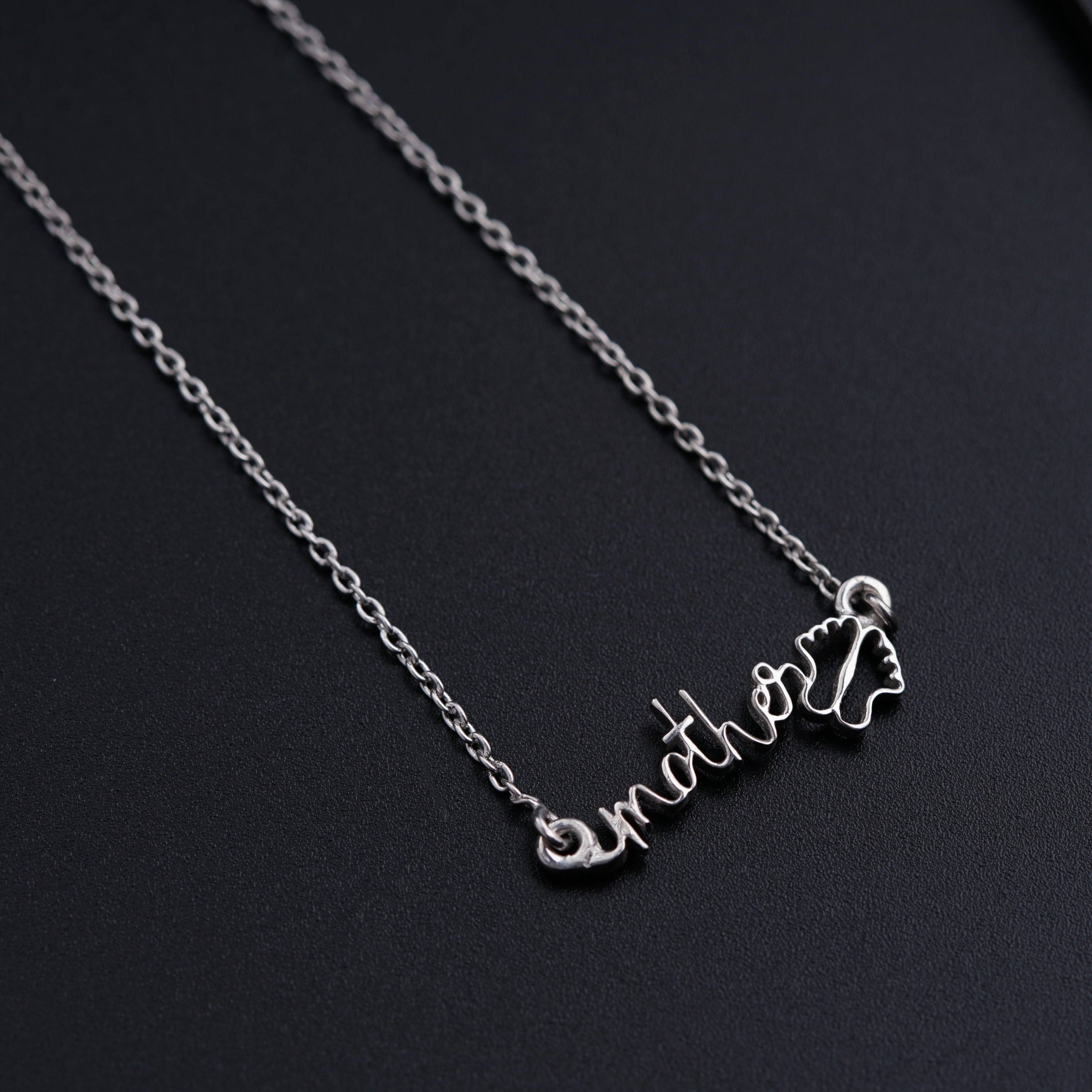 a necklace with a name and a heart on it
