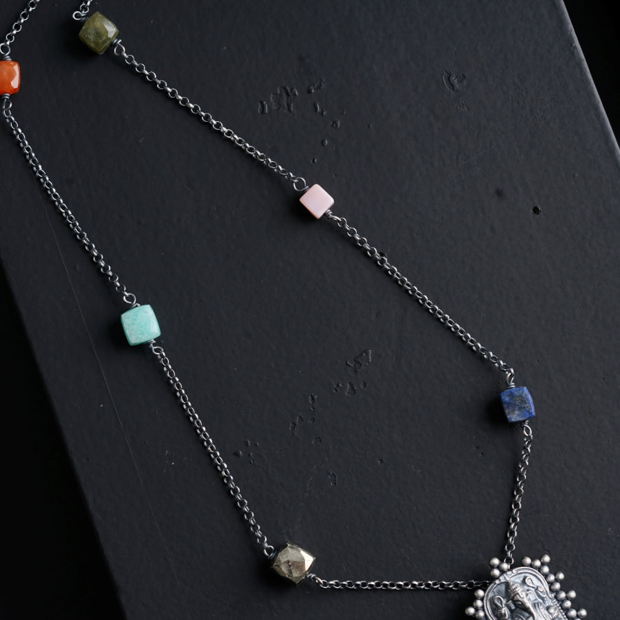 a necklace with a picture of a woman on it