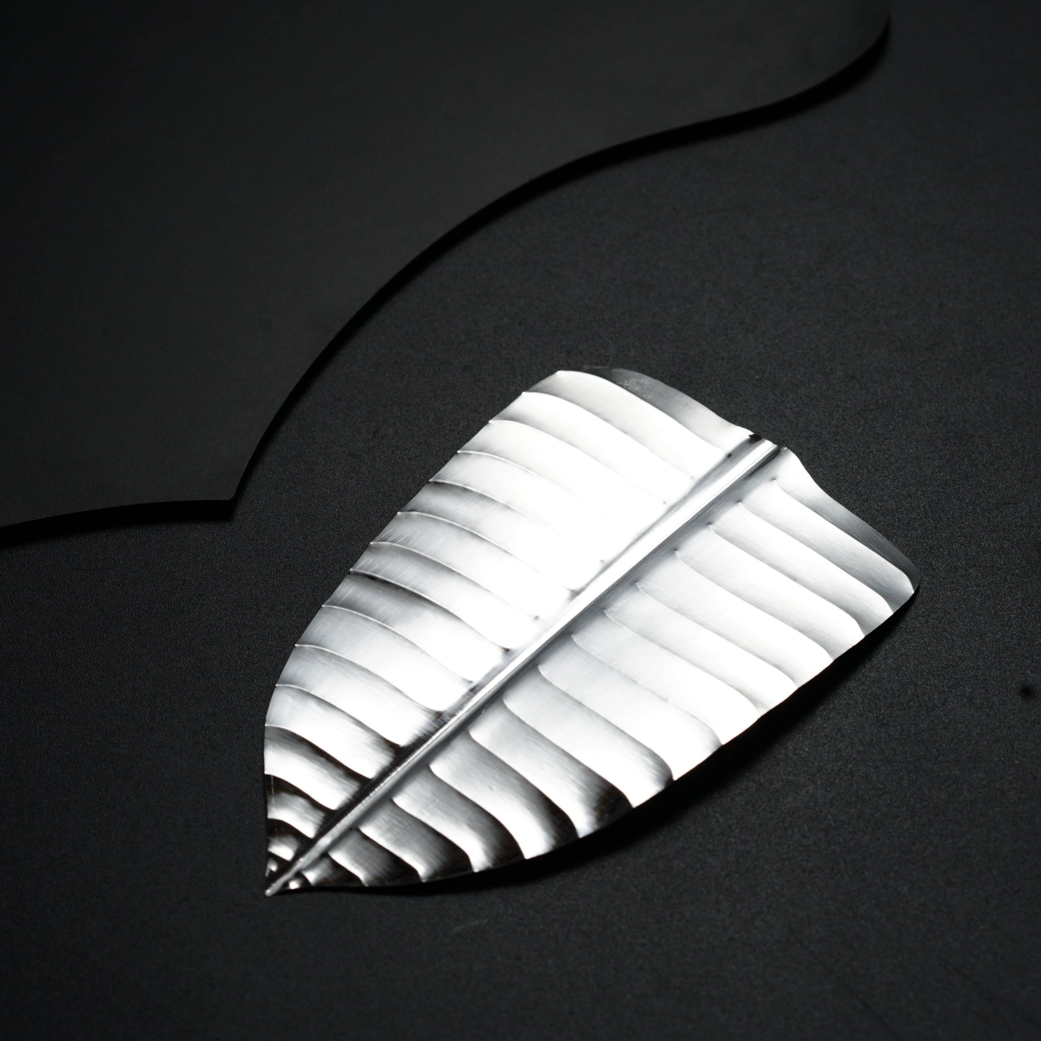 a piece of metal sitting on top of a table