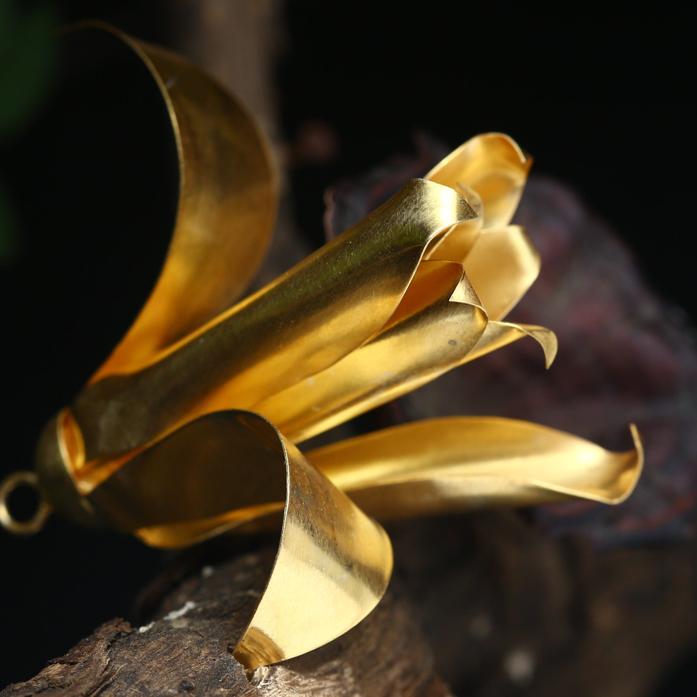 a close up of a piece of gold metal