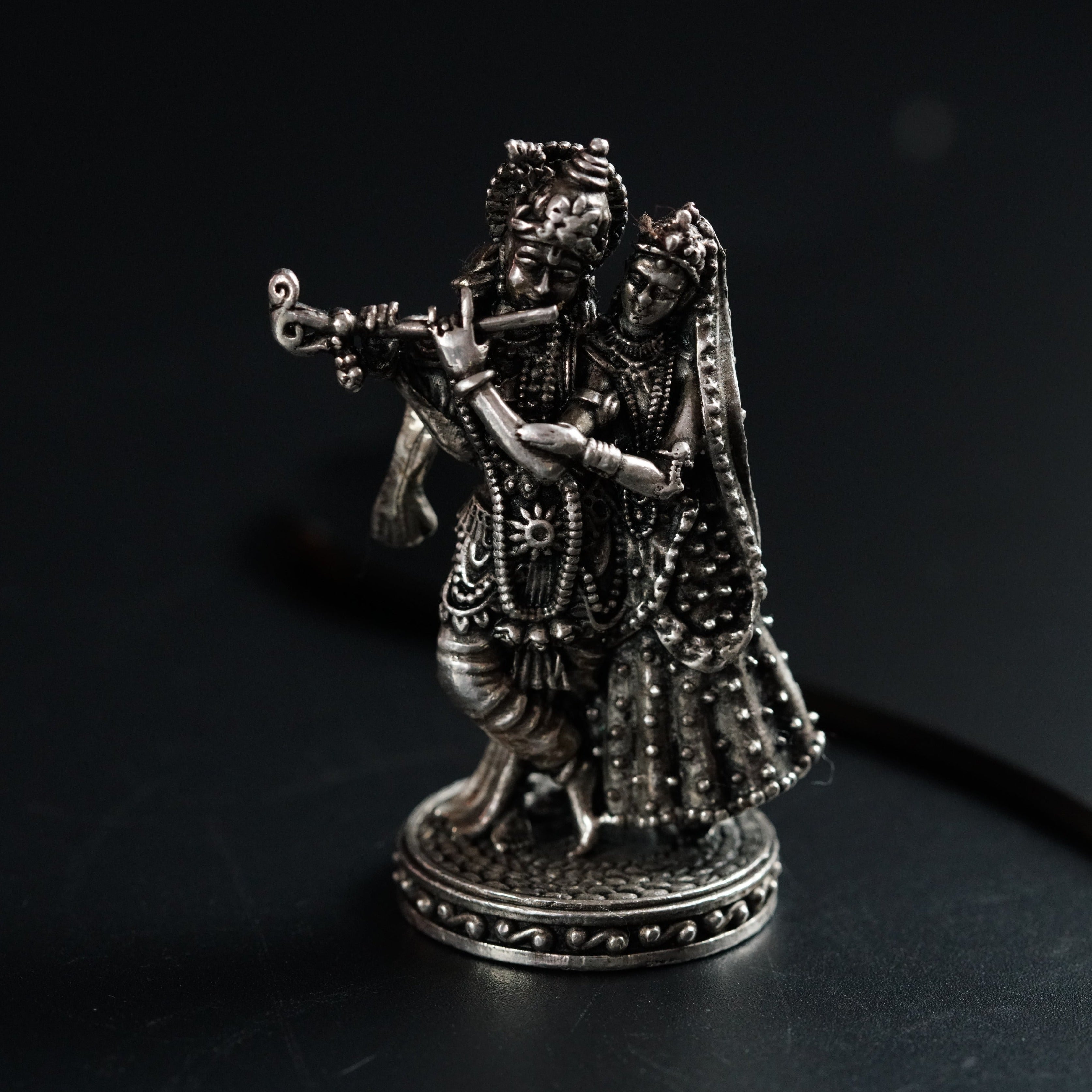 a statue of a man with a flute