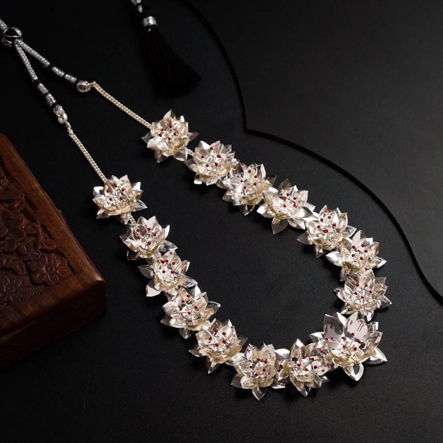 a close up of a necklace on a table