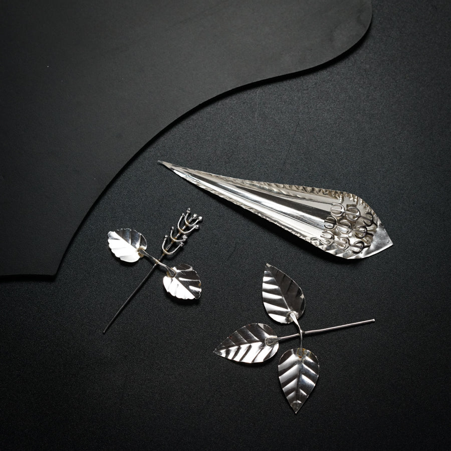 a pair of scissors and a pair of leaves on a table