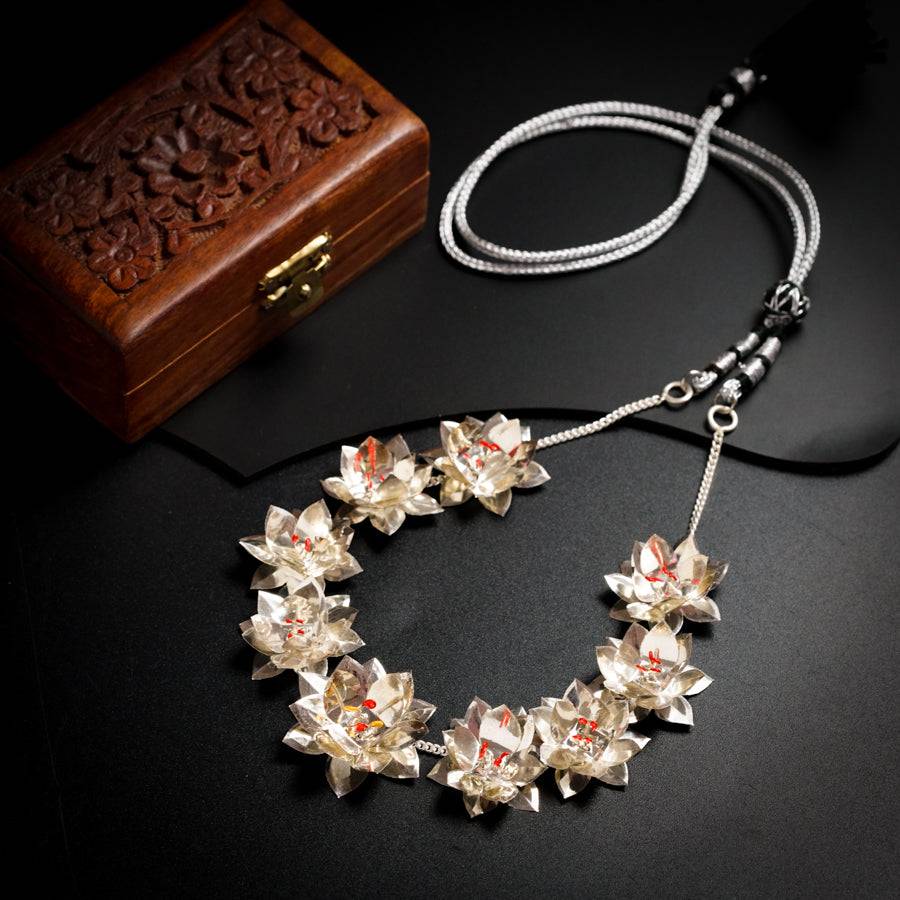 a necklace and a box on a table