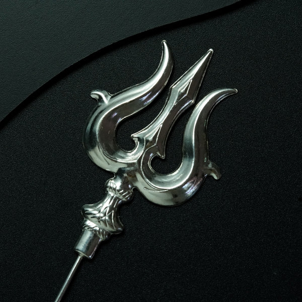 a close up of a metal object on a black surface