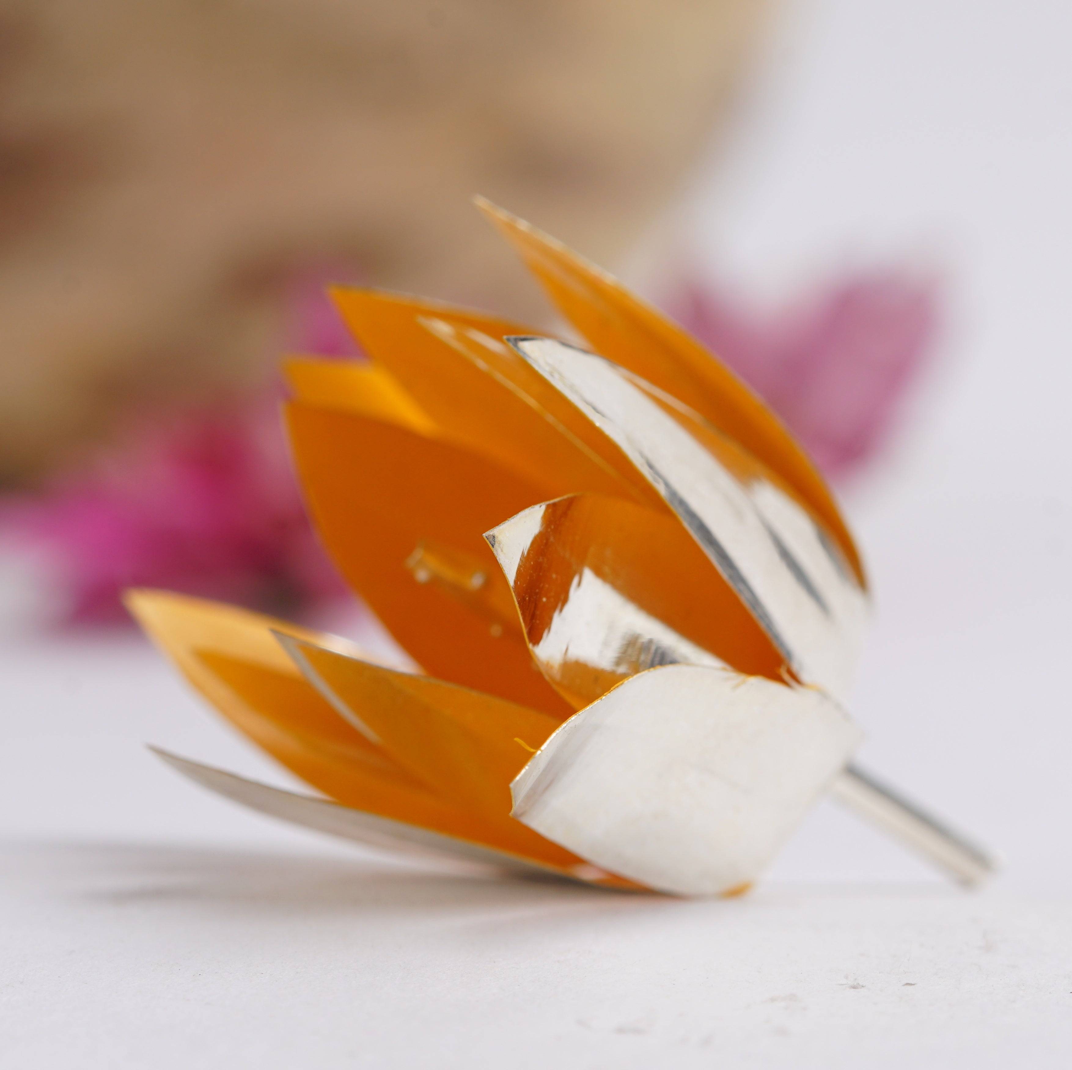 a close up of a flower shaped object on a table