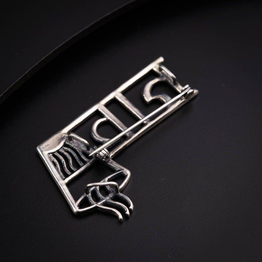 a close up of a metal object on a black surface